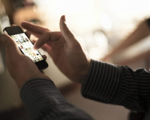 Closeup of a man using a phone